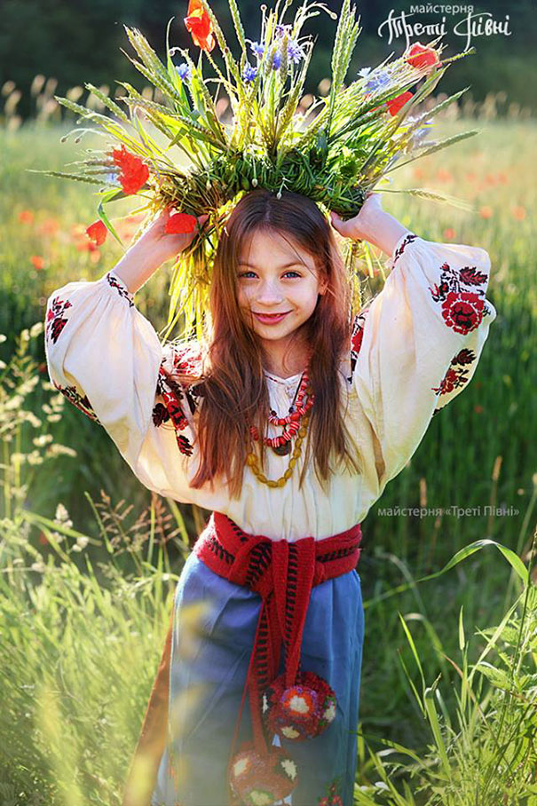 Ukrainian girl in traditional dress with vinok wreath